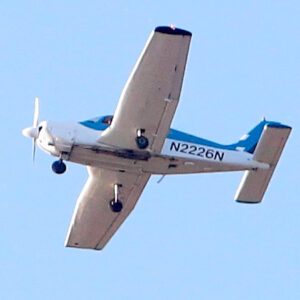 White and blue Cessna with N2226N letters on side.